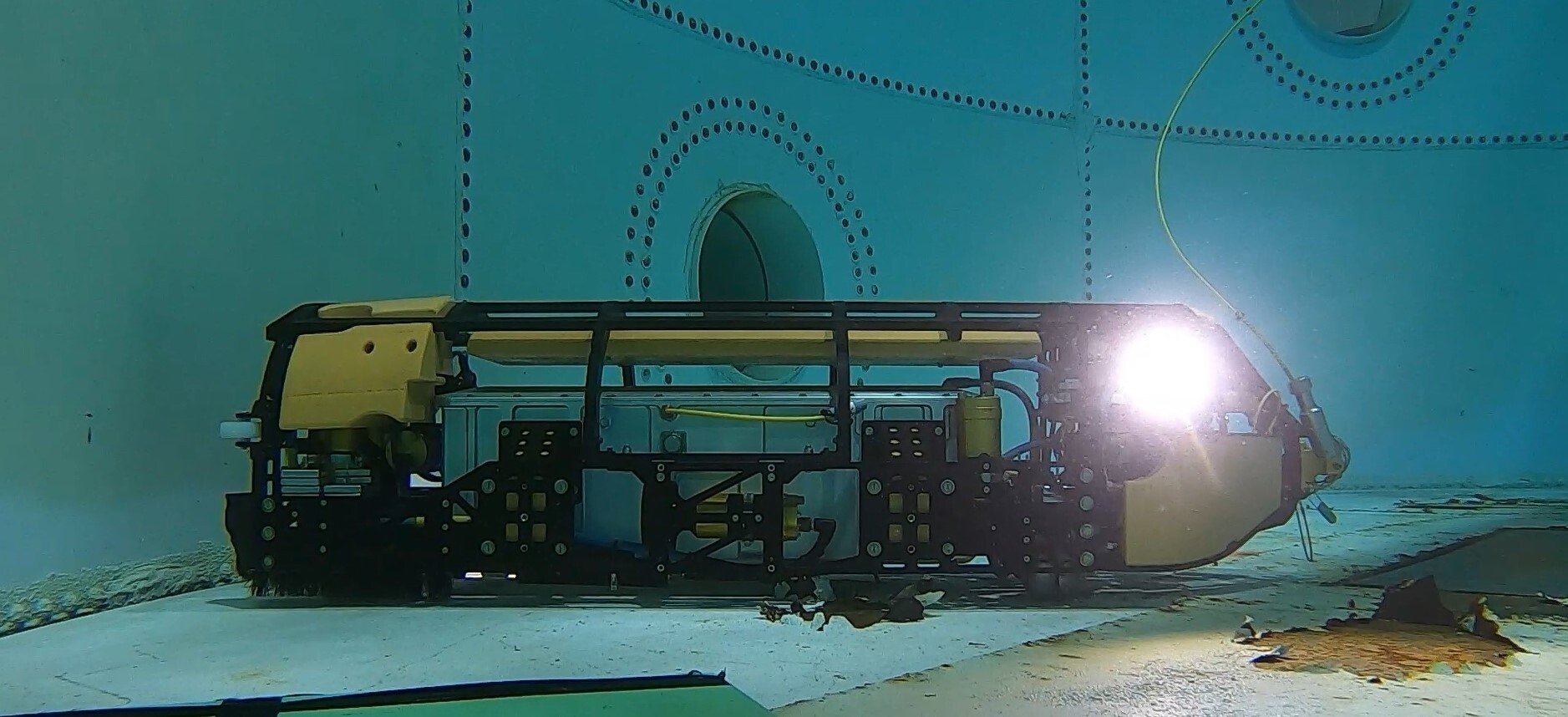 Square Robot submersible robot scanning the floor of an in-service tank